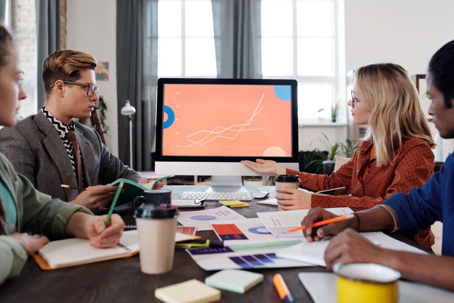 An SEO specialist reviewing keyword rankings and traffic analytics on a dashboard