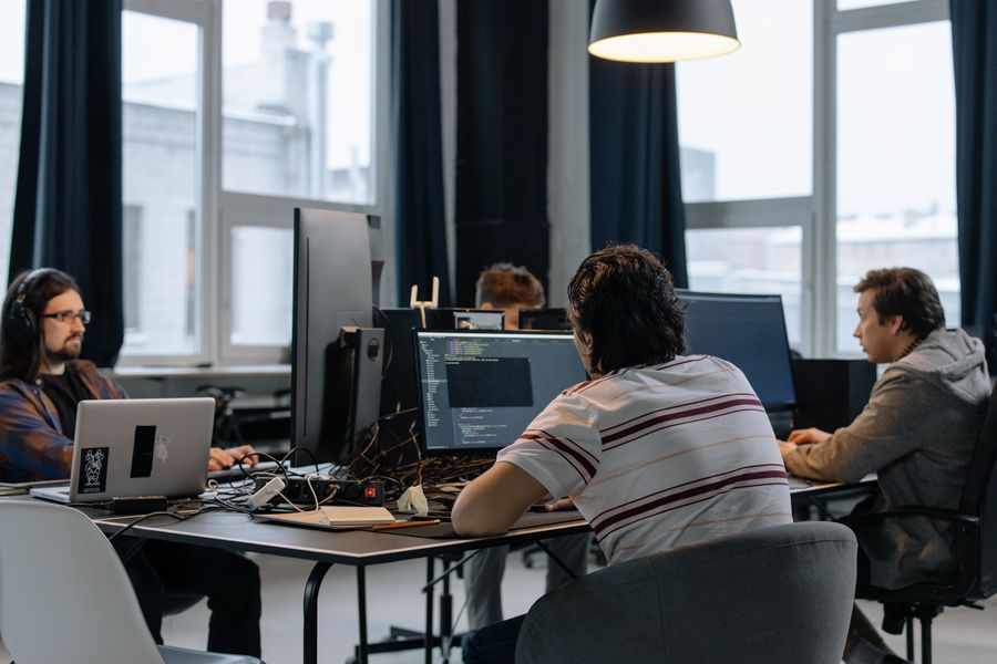 A team of software developers working together in a modern office